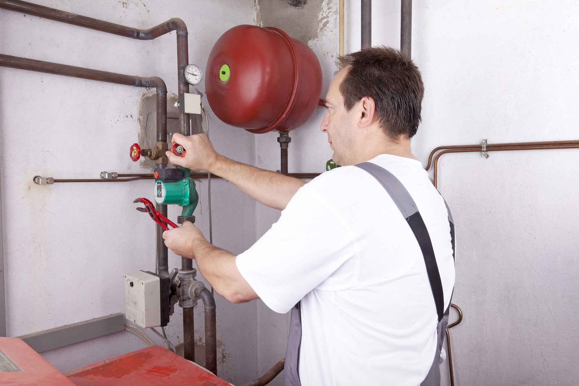 worker checking pipe leakage